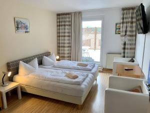 Postel nebo postele na pokoji v ubytování Hotel Reutiner Hof
