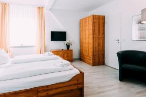 Postel nebo postele na pokoji v ubytování Hotel Brandaris