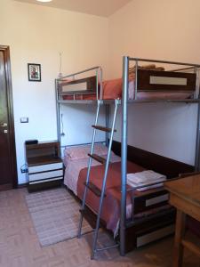 Poschodová posteľ alebo postele v izbe v ubytovaní Miravalle