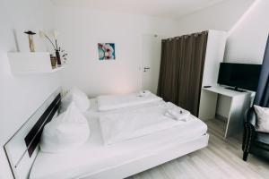 Postel nebo postele na pokoji v ubytování Hotel Brandaris
