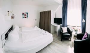 Postel nebo postele na pokoji v ubytování Hotel Brandaris
