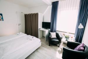 Postel nebo postele na pokoji v ubytování Hotel Brandaris