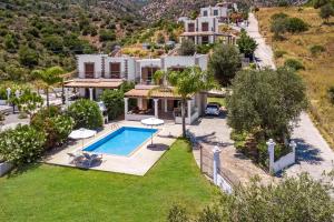 an aerial view of a villa with a swimming pool at Villa AmberBlue Kalathos in Kalathos