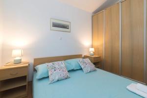 Postel nebo postele na pokoji v ubytování Apartmani Lenka