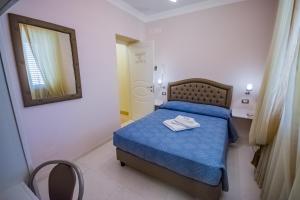 Llit o llits en una habitació de Sogno D'Epoca 1822