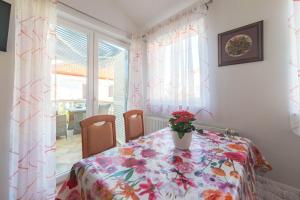 Postel nebo postele na pokoji v ubytování Apartmani Lenka