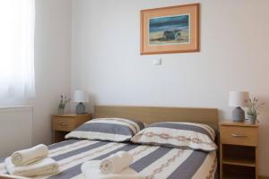 Postel nebo postele na pokoji v ubytování Apartmani Lenka