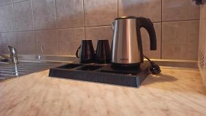 a coffeemaker sitting on top of a kitchen counter at House Chrysoula Mitsokopi in Sarti