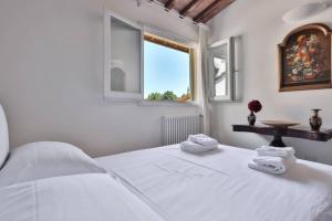 Posteľ alebo postele v izbe v ubytovaní Niccolò Terrace