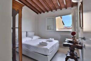 Posteľ alebo postele v izbe v ubytovaní Niccolò Terrace