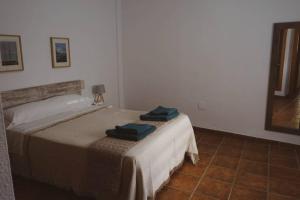 Postel nebo postele na pokoji v ubytování Casa Indalmar II San José