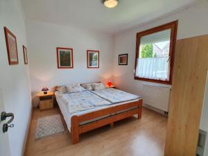 Кровать или кровати в номере Holiday House Filemon