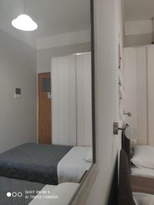 Postel nebo postele na pokoji v ubytování Hotel Trifylia