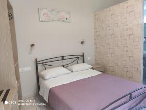 Postel nebo postele na pokoji v ubytování Hotel Trifylia