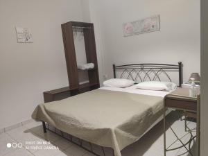 Postel nebo postele na pokoji v ubytování Hotel Trifylia