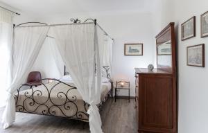 a bedroom with a bed with a canopy at Your Apartment Catania in Catania