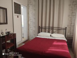 Postel nebo postele na pokoji v ubytování Hotel Trifylia