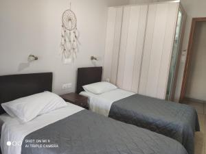 Postel nebo postele na pokoji v ubytování Hotel Trifylia