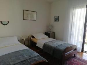 Postel nebo postele na pokoji v ubytování Apartment DUBA
