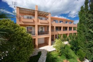 an aerial view of a building with trees at Zephyros Hotel in Skala