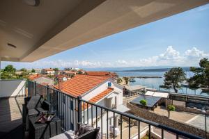 a balcony with a view of the water at Apartments Doris in Malinska