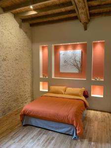 Ένα ή περισσότερα κρεβάτια σε δωμάτιο στο Les Ailes du Temps