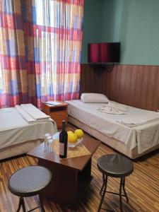 Un pat sau paturi într-o cameră la KM!Sofia - Стаи за гости