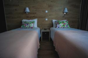 Postel nebo postele na pokoji v ubytování Quinta Chão da Bispa