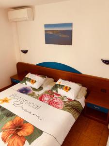 Postel nebo postele na pokoji v ubytování FUNTANA-MIA ROOMS B&B