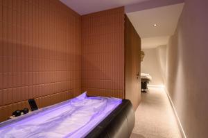 a bedroom with a bed in a room at Zlata Ladjica Boutique Hotel in Ljubljana