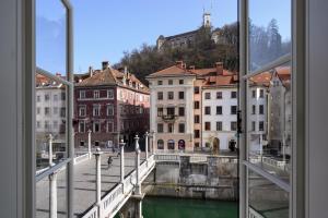 a view of a city from a window at Zlata Ladjica Boutique Hotel in Ljubljana