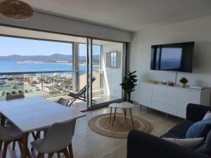 a living room with a view of the ocean at Vue mer exceptionnelle in Le Lavandou
