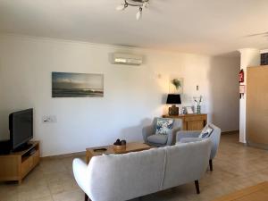 Телевизор и/или развлекательный центр в Âncora Boutique Apartments