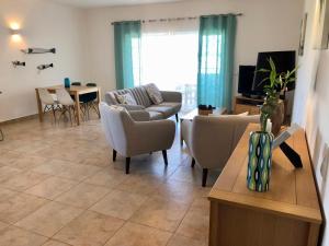 Телевизор и/или развлекательный центр в Âncora Boutique Apartments