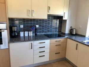 Кухня или мини-кухня в Âncora Boutique Apartments
