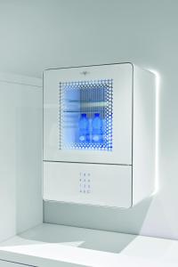 two bottles of water are inside of a microwave oven at YouMe Design Place Hotel in Trieste