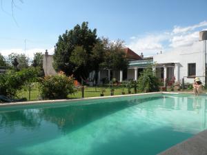 a swimming pool in front of a house at Casa Bellavista in Villa Lía