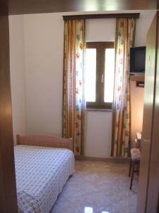 Postel nebo postele na pokoji v ubytování Guest House Caterina