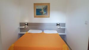 a small room with a bed in it at Residence Nido Verde in Peschici