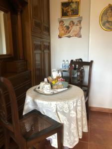 a table with a plate of food on top of it at L'Arca in Talsano