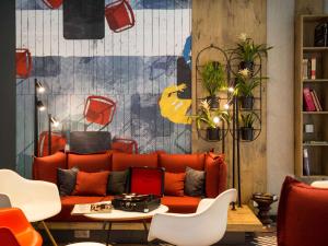 a living room filled with furniture and decorations at ibis Vilnius Centre in Vilnius