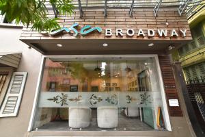 a storefront window of a store with a sign on it at Casa Broadway-A Boutique Hotel in Kolkata