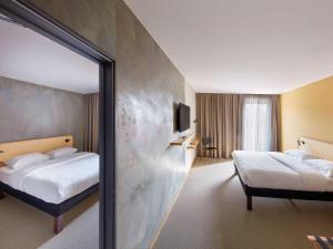 Postel nebo postele na pokoji v ubytování ibis Styles Bayreuth