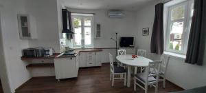 Kuchyň nebo kuchyňský kout v ubytování Ubytování v soukromí - Apartmán MERAN