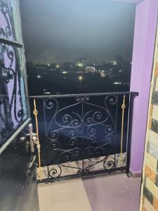 a balcony with a view of a city at Residence Sighaka - Gold Apartment - WiFi, Gardien, Parking in Douala