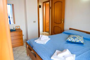 En eller flere senge i et værelse på Villa Cloe Caprioli-Palinuro