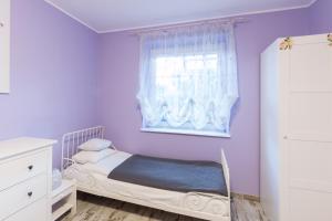 Łóżko lub łóżka w pokoju w obiekcie Apartamenty Barakuda