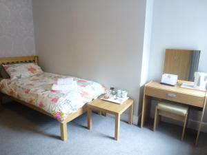 Postel nebo postele na pokoji v ubytování Orrell Park Hotel