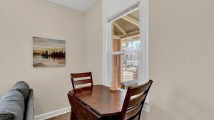 a dining room with a table and a window at A Home Base for your Journey in Colorado Springs