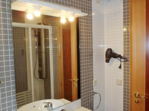 a bathroom with a sink and a mirror at El Balconcito de San Millan II in Segovia +28 photos